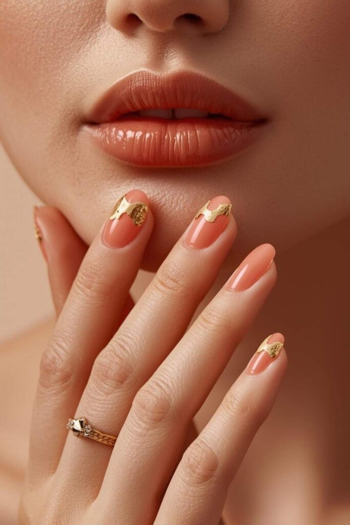 Sheer coral cute acrylic nail designs with gold foil cuticle accents on oval nails
