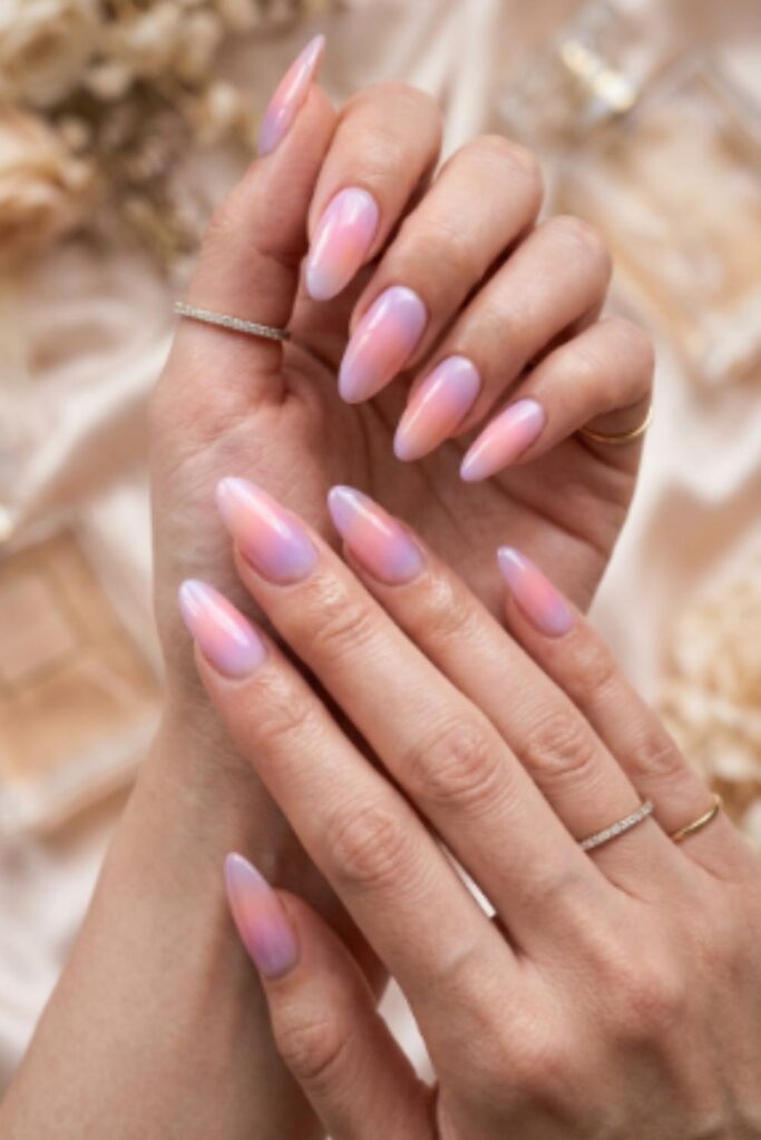 Soft pastel aura gradient Long Nail Designs blending pink, lavender, and peach shades seamlessly.