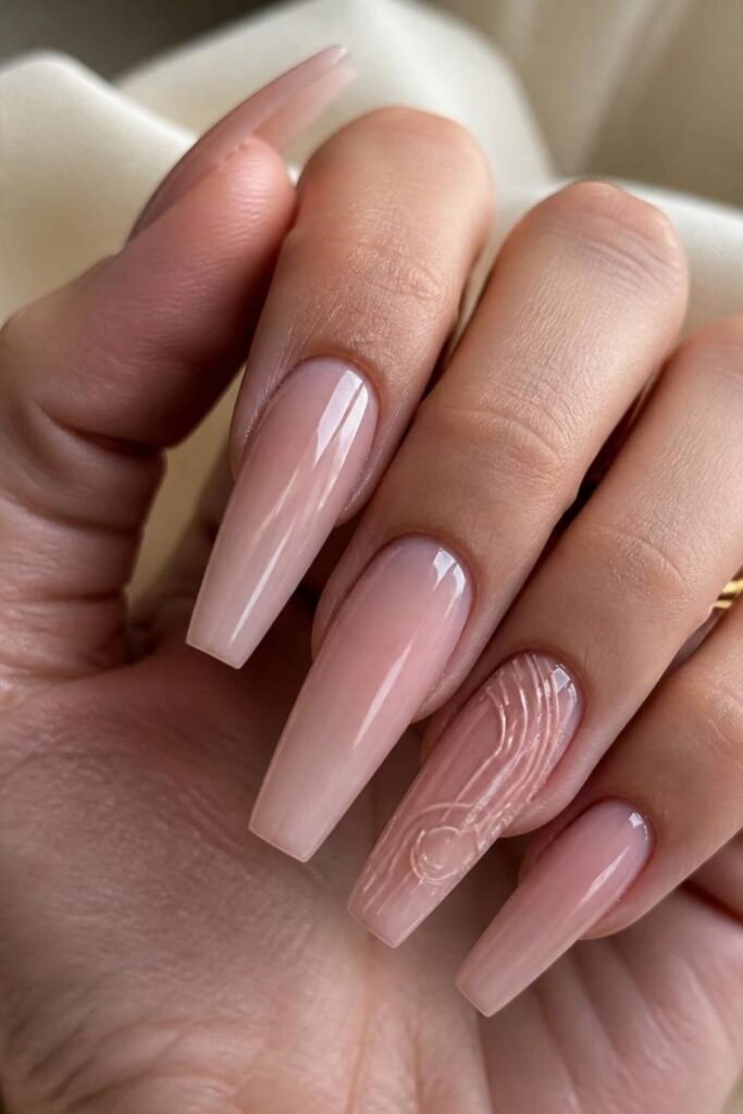 Barely pink coffin long acrylic nail inspo with minimalist 3D line art.