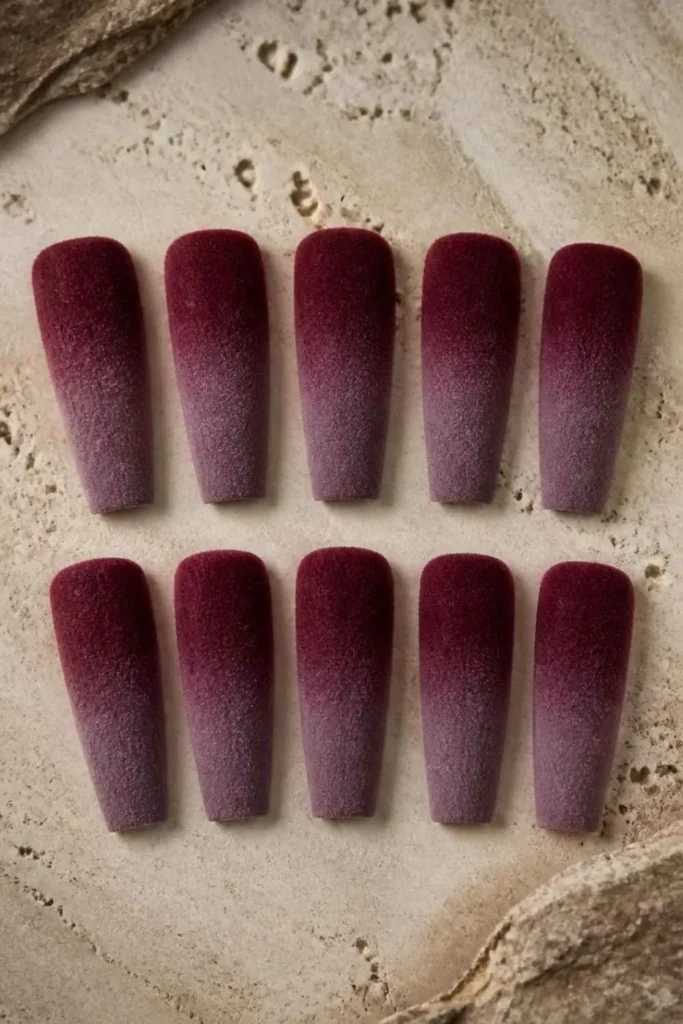 Long coffin Velvet Gel Nails with a burgundy to deep mauve ombré created using flocking powder and a soft velvet texture.