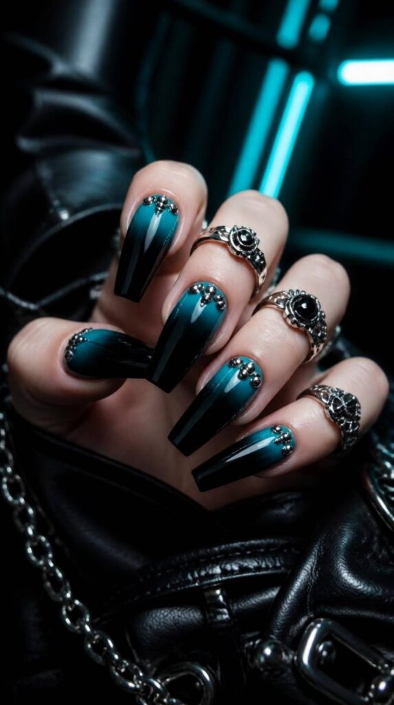 Deep teal and black ombre gothic acrylic nail designs featuring silver stud clusters on coffin nails.
