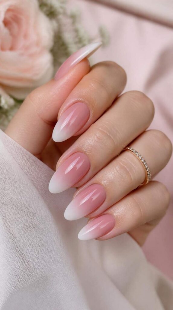 Dusty rose jelly acrylic nails with a soft French tip gradient and elegant translucent glossy finish.