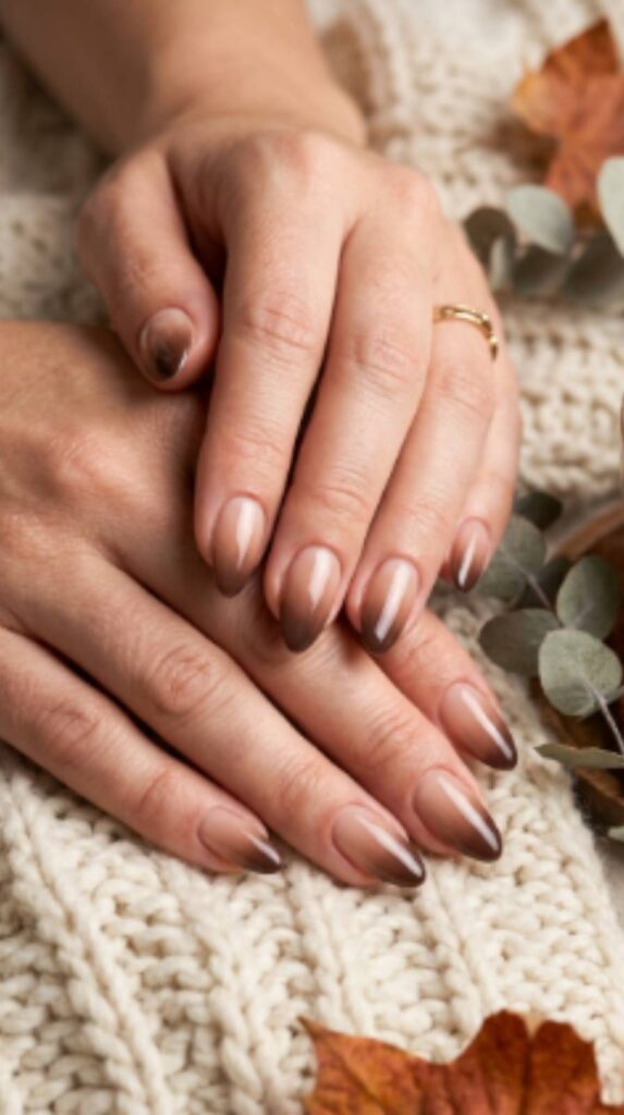 Glossy aesthetic brown fall nails with a smooth ombré blend from soft nude beige to rich dark chocolate tips.