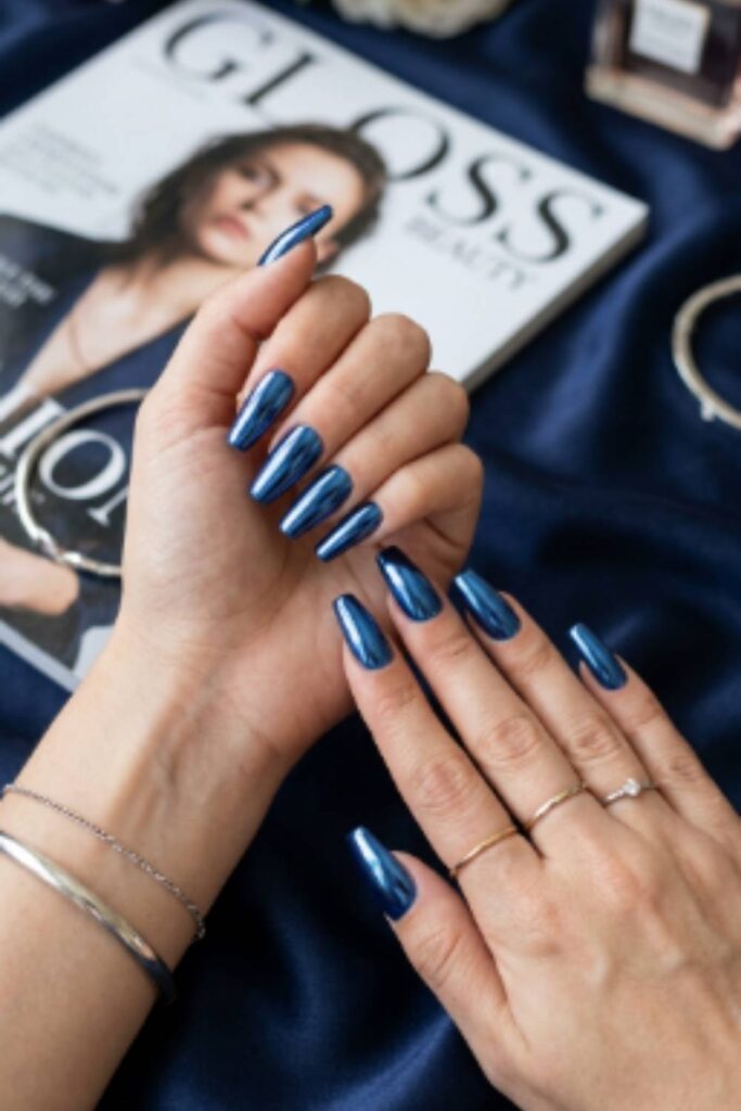 Metallic royal blue chrome Long Nail Designs with mirror-like finish on long coffin nails.