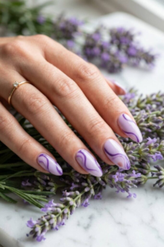 Soft lilac nails with dark purple abstract swirl nail art and glossy gel finish.